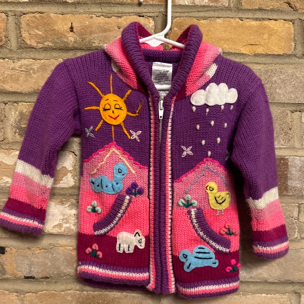 Hand knitted toddler zip up sweater with hood made in Peru
